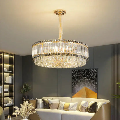 A modern two-tiered decorbites crystal chandelier with gold fixture and clear faceted glass rods for elegant lighting