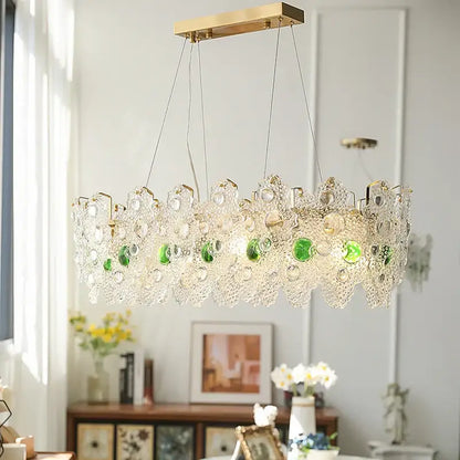 A modern decorbites crystal chandelier with gold metal frame and clear glass green beads for elegant retro lighting