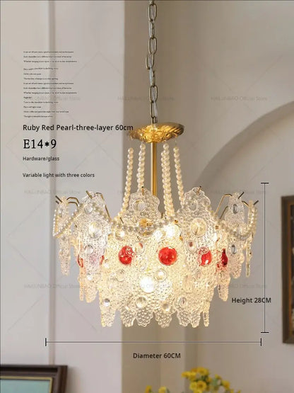 Elegant three-layer decorbites crystal chandelier with gold-toned hardware and ruby red pearl accents for home lighting