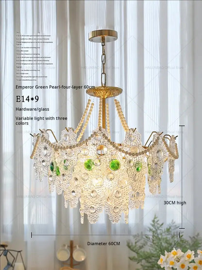 A luxurious four-layer decorbites crystal chandelier with golden brass frame, crystal beads, and emerald glass pearls