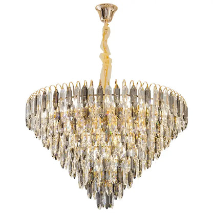 A decorbites crystal chandelier with heart-shaped clear and gold glass prisms hanging from polished brass mount
