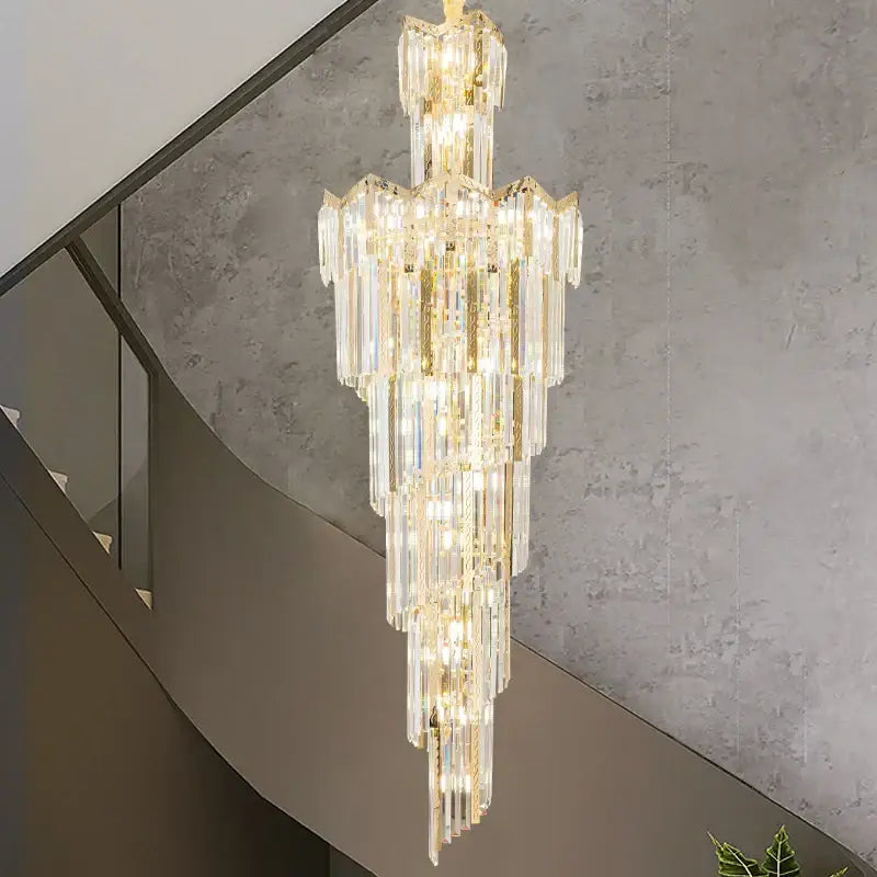 A decorbites crystal chandelier featuring tiered faceted glass rods and gold metal accents for luxury villa lighting
