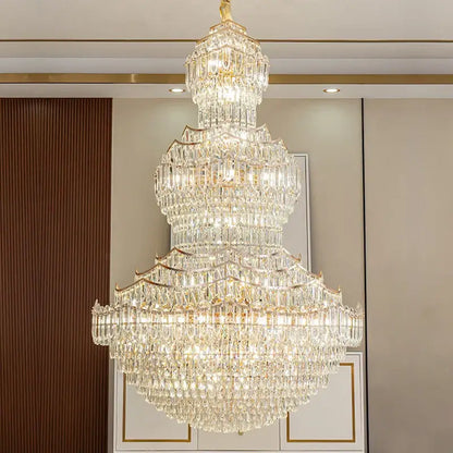 A multi-tiered decorbites crystal chandelier with gold-toned metal and clear glass prisms for European villa lobbies