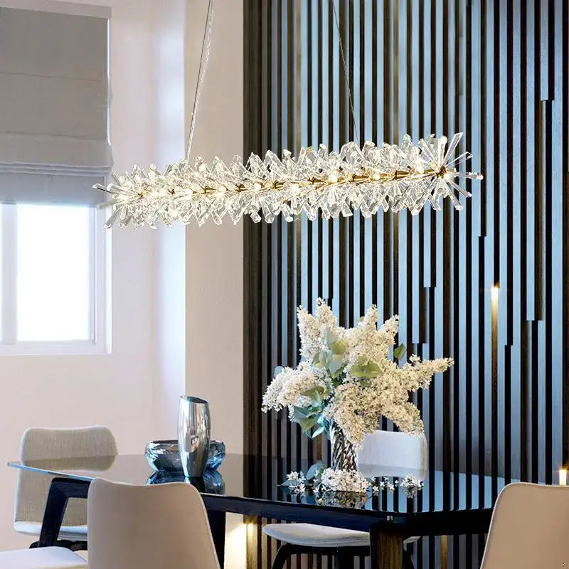A decorbites crystal chandelier flower with a gold-toned frame and clear crystals in a starburst luxury design for indoor spaces