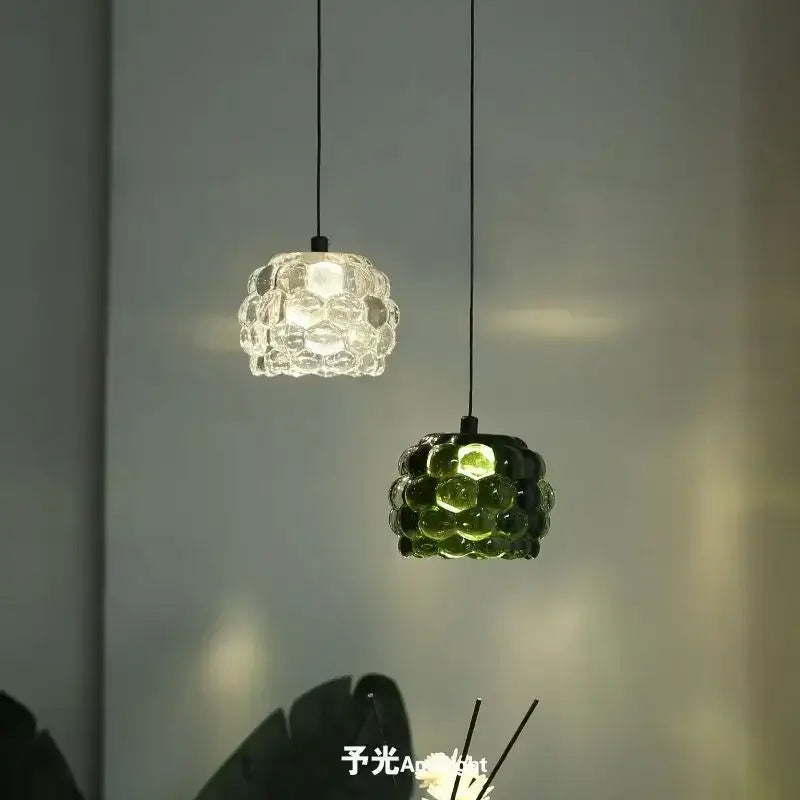 Two pendant lights with clustered bubble glass shades one clear and one emerald green from decorbites crystal chandelier for store cashier area