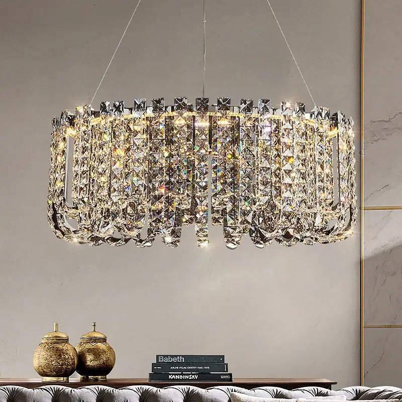Elegantly designed DecorBites crystal chandelier with cascading clear faceted crystals and a sleek metallic frame