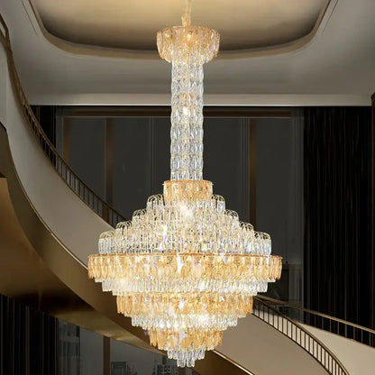 Decorbites crystal chandelier with cascading clear and amber glass prisms on gold frame for duplex living room