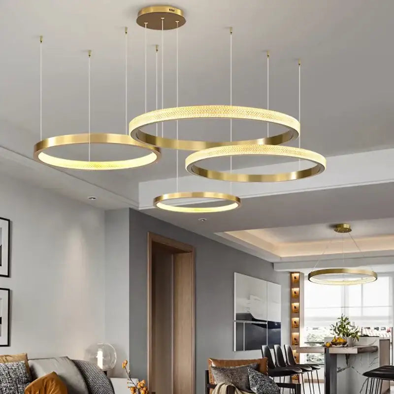 Gold-toned decorbites crystal chandelier with interlocking rings and sparkling crystals for living and dining room decor