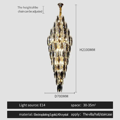 A tall decorbites crystal chandelier with cascading clear and dark crystals in electroplated gold for luxe decor