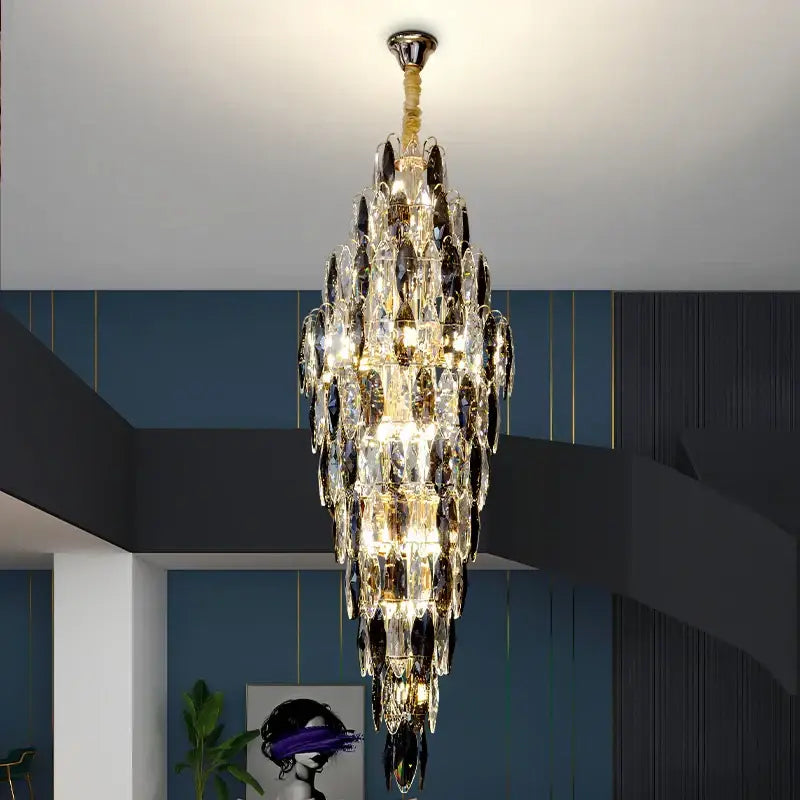 DecorBites crystal chandelier with cascading clear and dark crystal droplets on polished brass for luxe villa decor