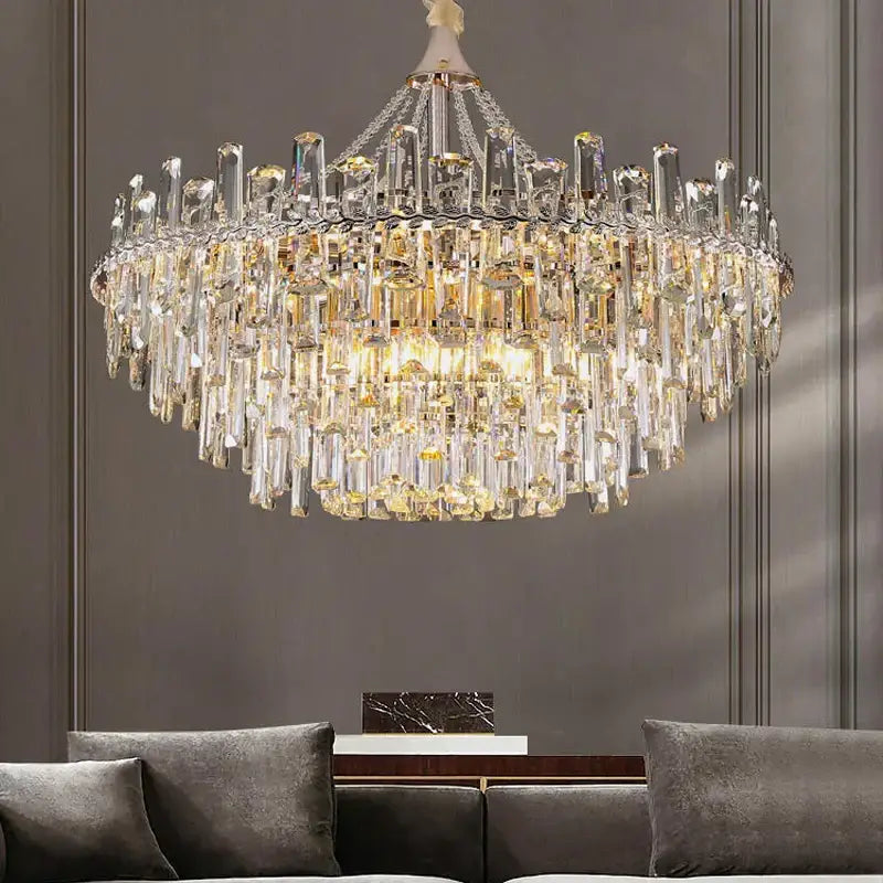 Decorbites crystal chandelier with multi-tiered clear and golden prisms on polished metal for modern luxe interiors