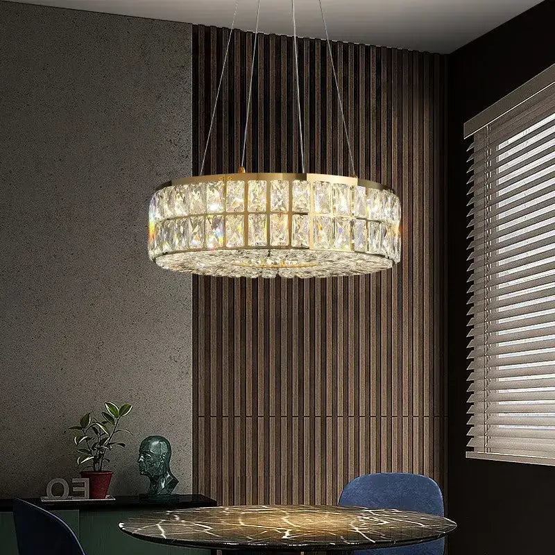 A modern decorbites crystal chandelier with gold frame and faceted crystal prisms for living and dining rooms