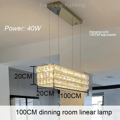 A decorbites crystal chandelier featuring a 100cm rectangular design with sparkling crystal tiers and a metallic mount for dining rooms