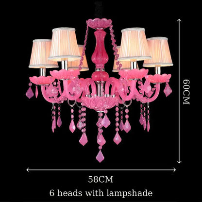 A vibrant pink DecorBites crystal chandelier with six lampshades and gemstone accents for elegant indoor lighting