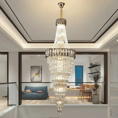 Multi-tiered decorbites crystal chandelier with gold-toned metal frame and glass prisms for luxury living spaces