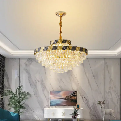 Gold-toned decorbites crystal chandelier with cascading droplets and geometric black and gold upper ring for luxury lighting