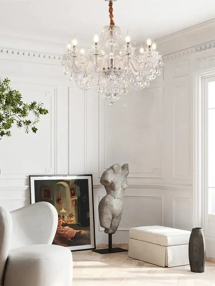 Decorbites crystal chandelier led candle with multiple arms and hanging bulbs suspended from braided rope