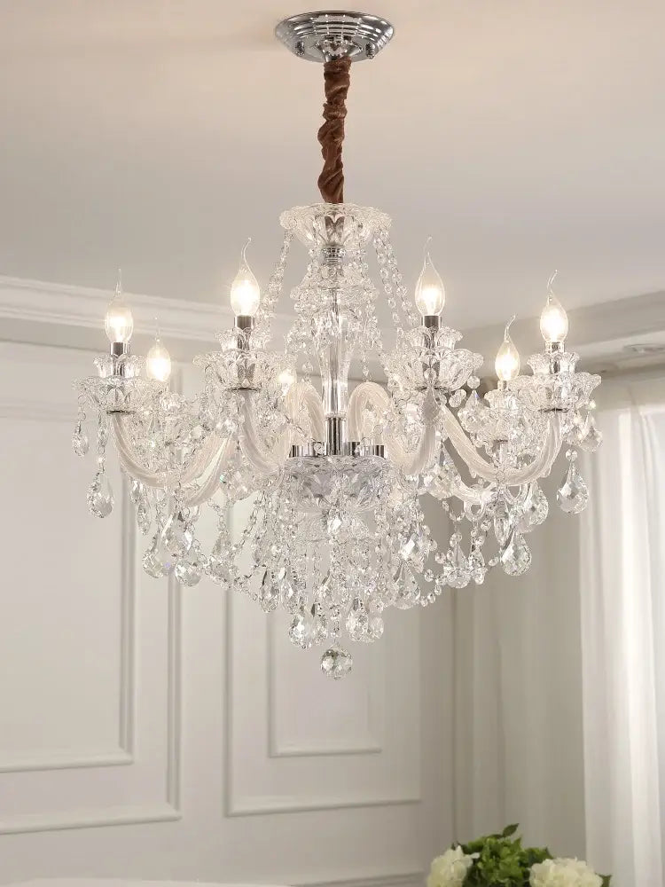 Decorbites crystal chandelier led candle with multiple arms and k9 crystal droplets hanging from a chrome ceiling mount