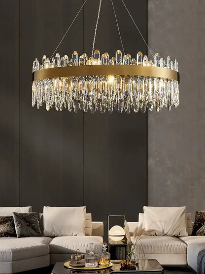 A modern decorbites crystal chandelier led with gold metal frame and clear crystal prisms for dining room use