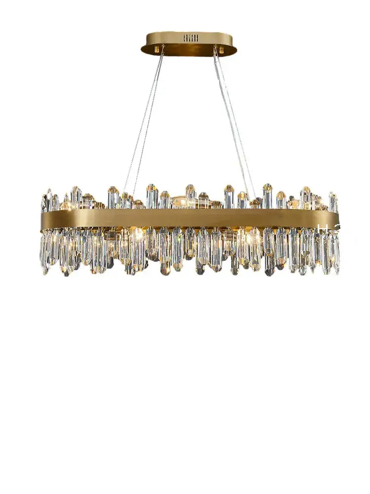 A modern decorbites crystal chandelier led with gold-toned frame and clear glass prisms for dining room lighting