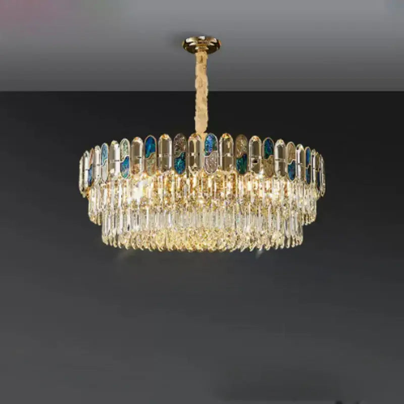 Gold-toned decorbites crystal chandelier with cascading clear crystals and blue-tinted glass panels for living room lighting