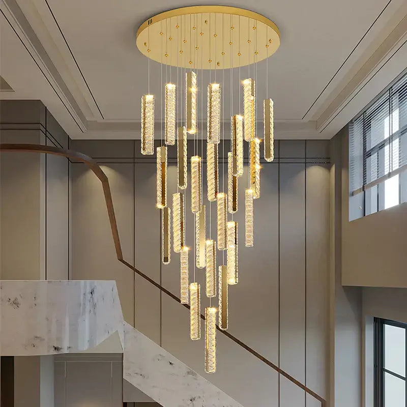 Gold-toned DecorBites crystal chandelier with cascading crystal rods and warm LED light for mezzanine dining room