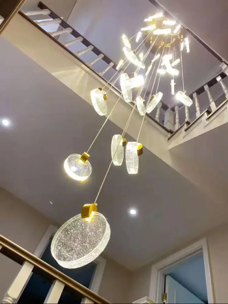 DecorBites crystal chandelier led pendant light with cascading circular glass orbs and gold fixtures for modern duplex stairs