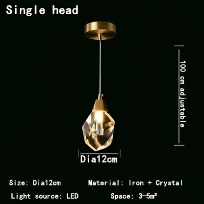 A sleek modern decorbites crystal chandelier led pendant light with a faceted crystal globe and iron fixture for nordic decor