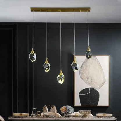 DecorBites™ crystal chandelier LED pendant lights feature five faceted crystal pendants with gold-toned brass fixtures