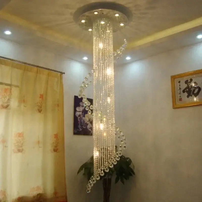 DecorBites crystal chandelier featuring a tall spiral design with multiple illuminated LED bulbs for luxury decor