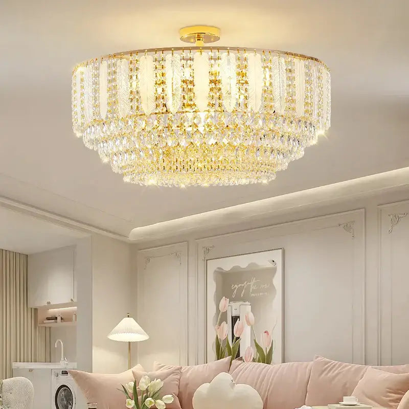 Gold-toned DecorBites crystal chandelier light with multiple tiers of faceted glass elements for elegant home decor