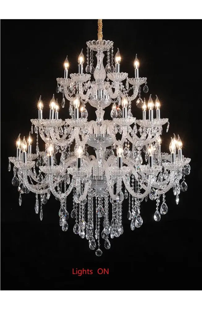 DecorBites crystal chandelier light with multiple tiers of teardrop crystals and candle-style bulbs for luxury rooms