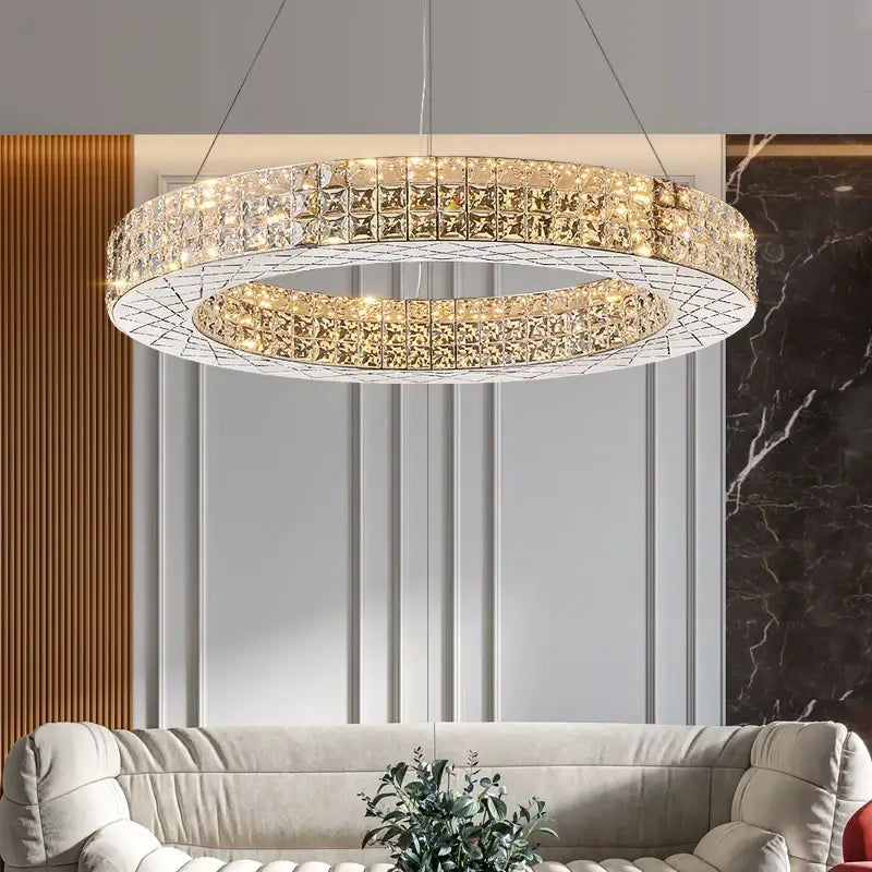 A double-ring decorbites crystal chandelier light with clear and gold-toned crystals for luxury living room design