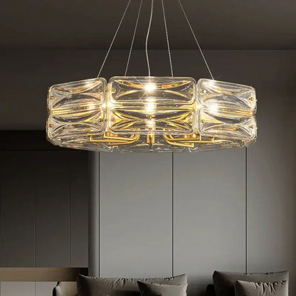 Clear glass decorbites crystal chandelier with gold metal accents and modern geometric design for luxury home lighting