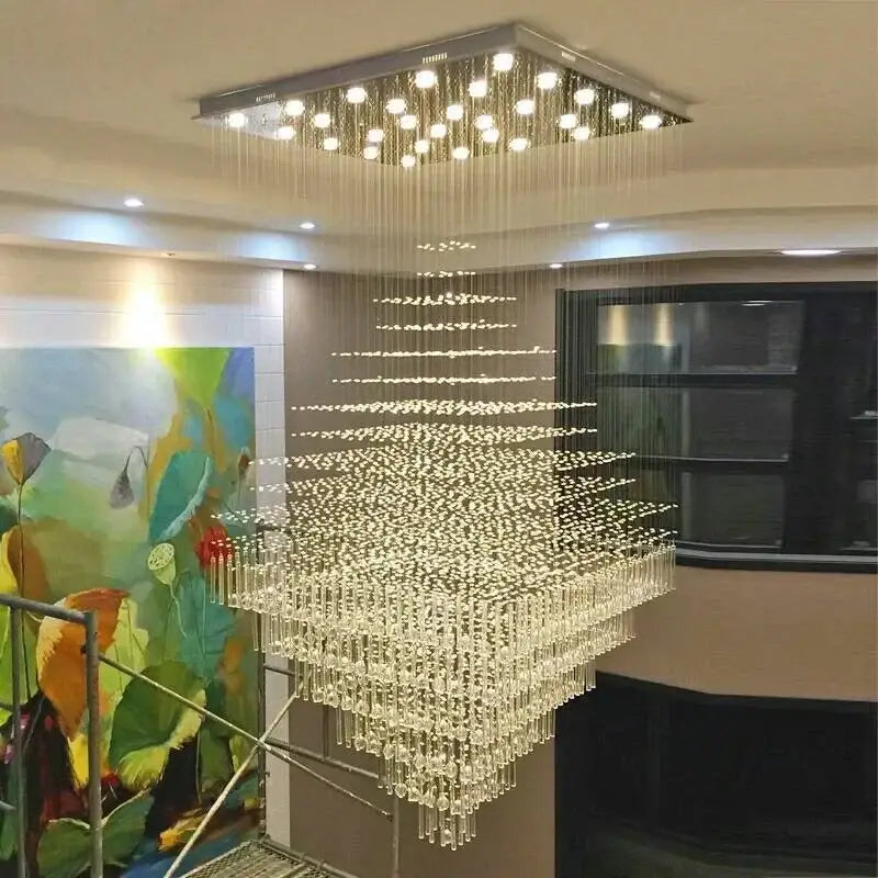 A modern decorbites crystal chandelier with multi-tiered crystal droplets and square mount for living room or hotel lobby lighting