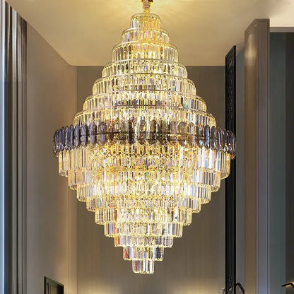 Decorbites crystal chandelier with multi-tiered clear and smoky glass prisms on gold-toned frame for luxe stairwell lighting