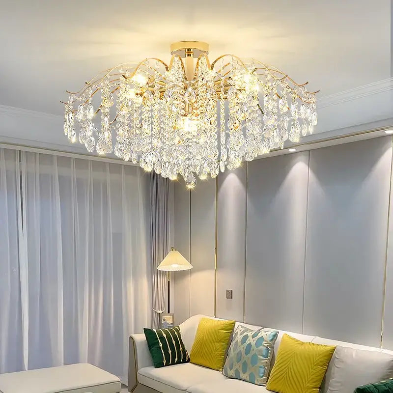 A decorbites crystal chandelier with a gold-toned frame and cascading clear crystals lighting fixture for luxury decor