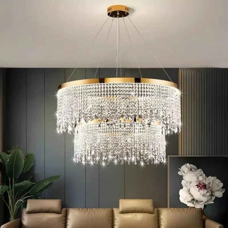 Luxurious decorbites crystal chandelier with tiered gold-toned accents and cascading clear crystals for ceiling lighting