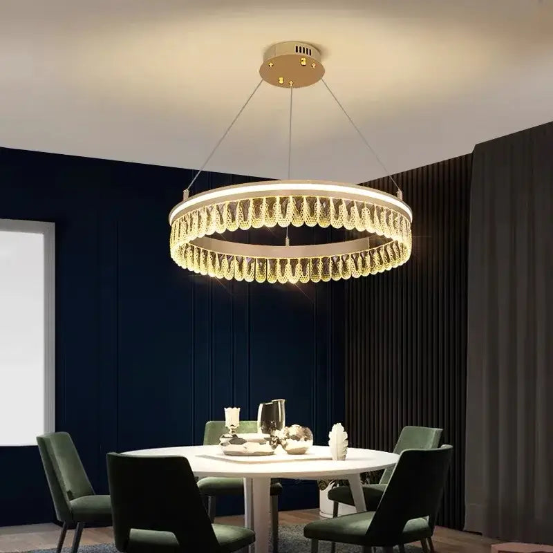 Modern gold-toned decorbites crystal chandelier with cascading crystal droplets for luxury living and dining lighting