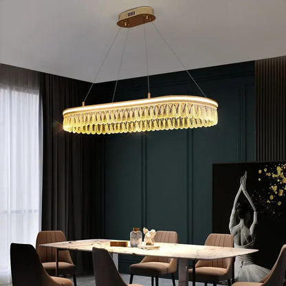 Gold-toned decorbites crystal chandelier with geometric design and cascading crystals for luxury LED lighting
