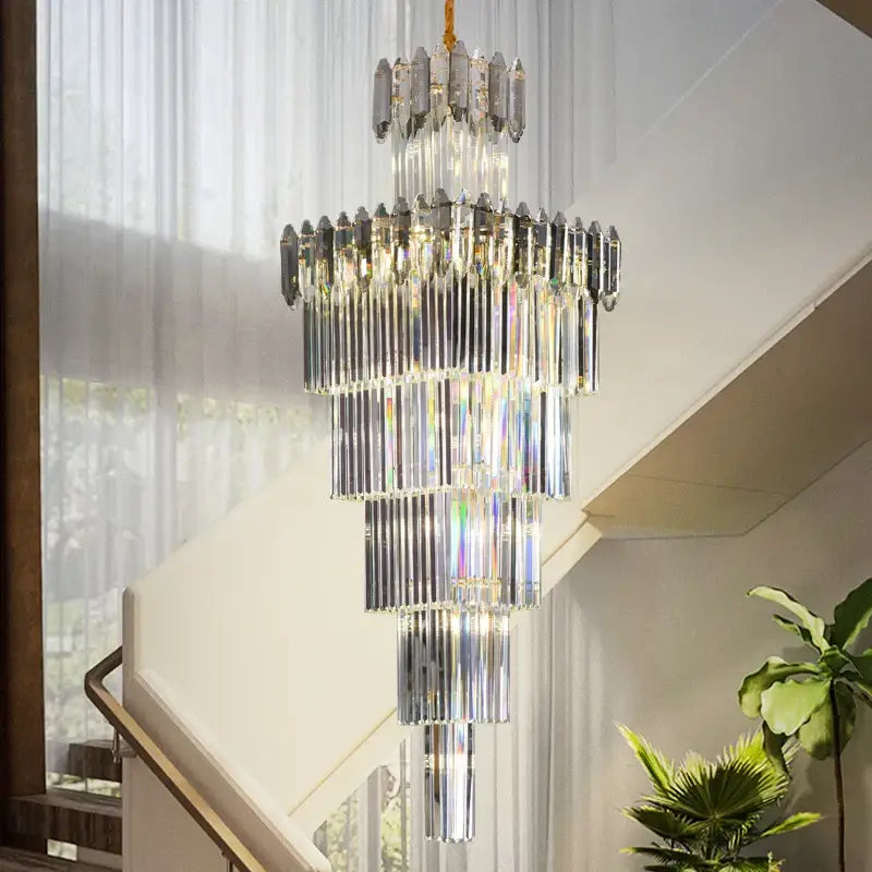 Decorbites crystal chandelier with cascading clear and silver glass rods suspended by a gold chain for luxury lighting