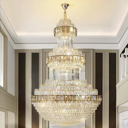 A decorbites crystal chandelier with a gold-toned metal frame and clear crystals for luxury lighting in villas and hotels