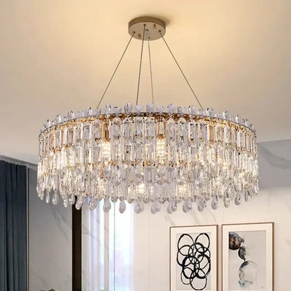A modern decorbites crystal chandelier with clear faceted glass and gold-toned metal for luxury living rooms and bedrooms