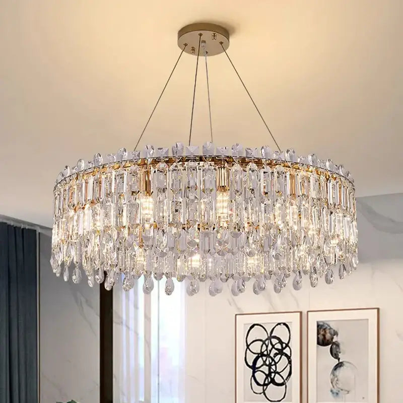 A modern decorbites crystal chandelier with clear faceted glass and gold-toned metal for luxury living rooms and bedrooms