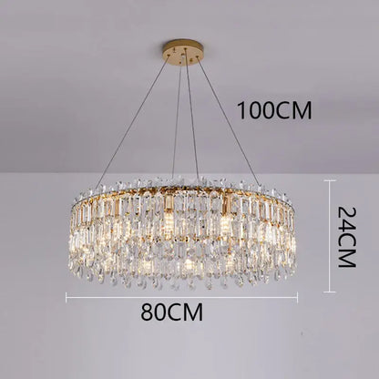 A luxurious gold-toned decorbites crystal chandelier with clear prism tiers and teardrop crystals for elegant living spaces