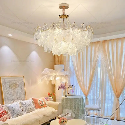 Elegant white crystal chandelier with gold-toned accents and scalloped fan design by DecorBites crystal chandelier for luxury decor