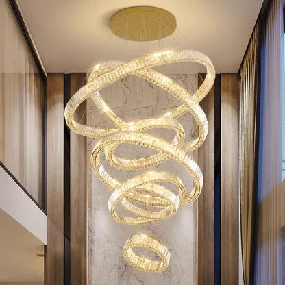 A modern decorbites crystal chandelier featuring gold-toned metal and clear crystal rings for luxury living rooms
