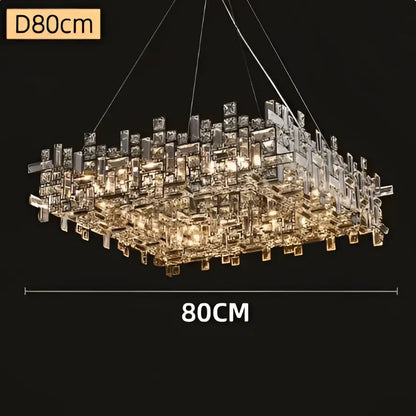 A modern decorbites crystal chandelier with clear and gold-toned prisms in a geometric design for luxury living rooms