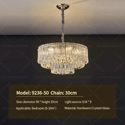 Elegant two-tiered decorbites crystal chandelier with polished brass fixture and clear glass prisms for luxury room lighting