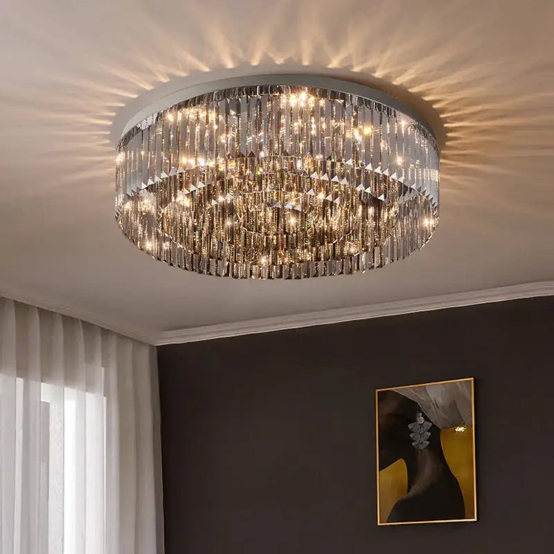 DecorBites crystal chandelier with multiple tiers of clear faceted crystal prisms on polished chrome frame